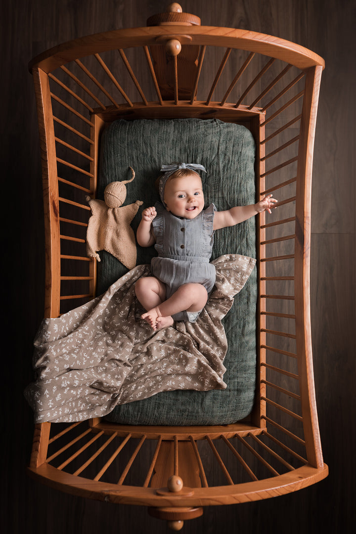 Child wearing Organic Muslin Ruffle Bodysuit in Twilight.