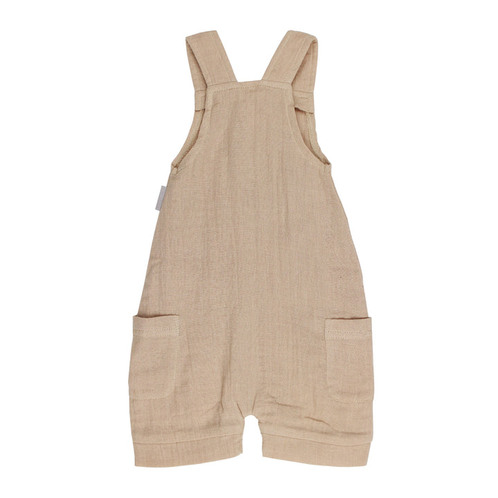 Back view of Cuffed Muslin Overall in Wheat.