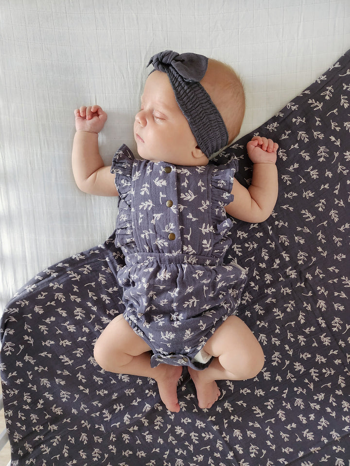 Child wearing Organic Muslin Smocked Headband in Dusk.