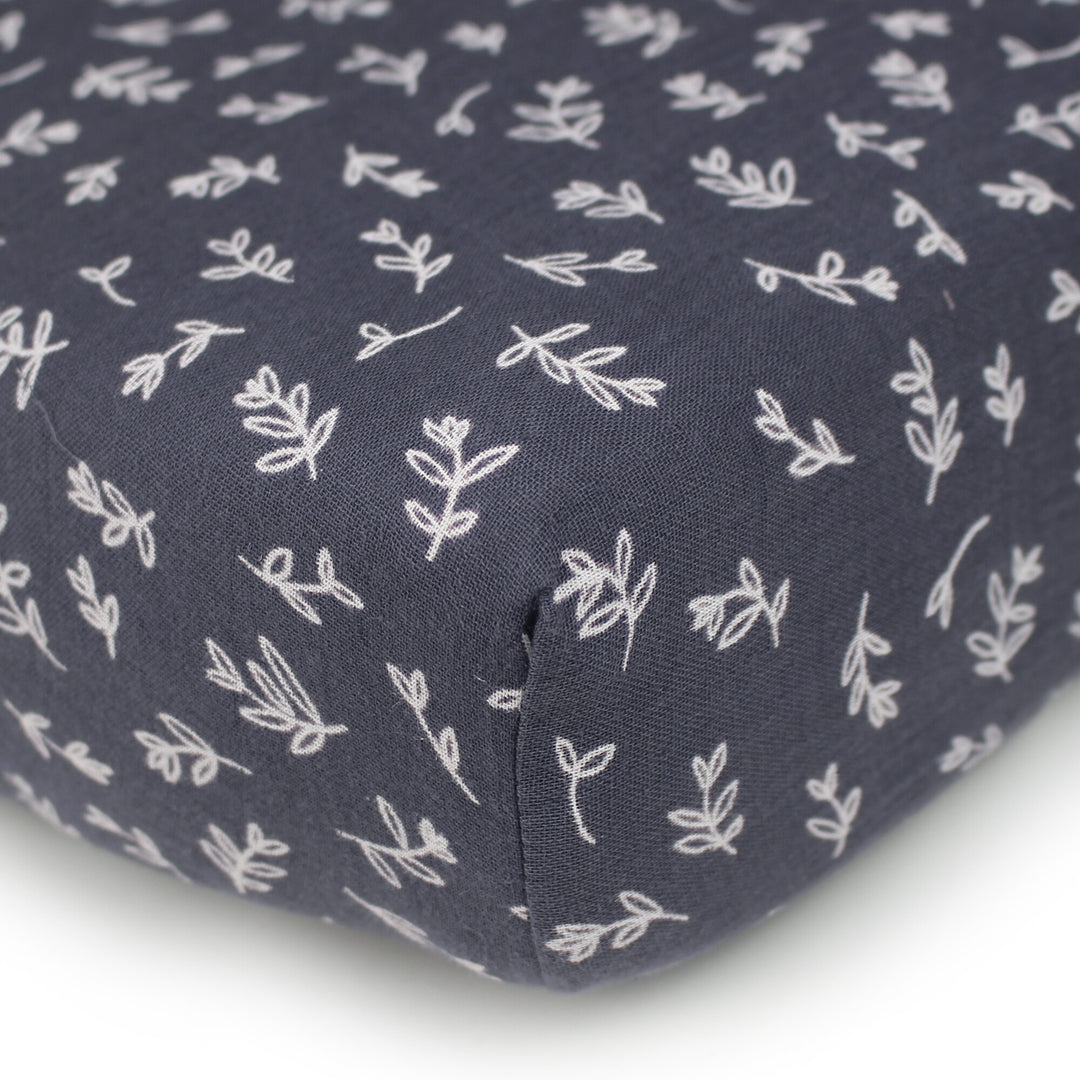 Organic Muslin Crib Sheet in Dusk Leaves.