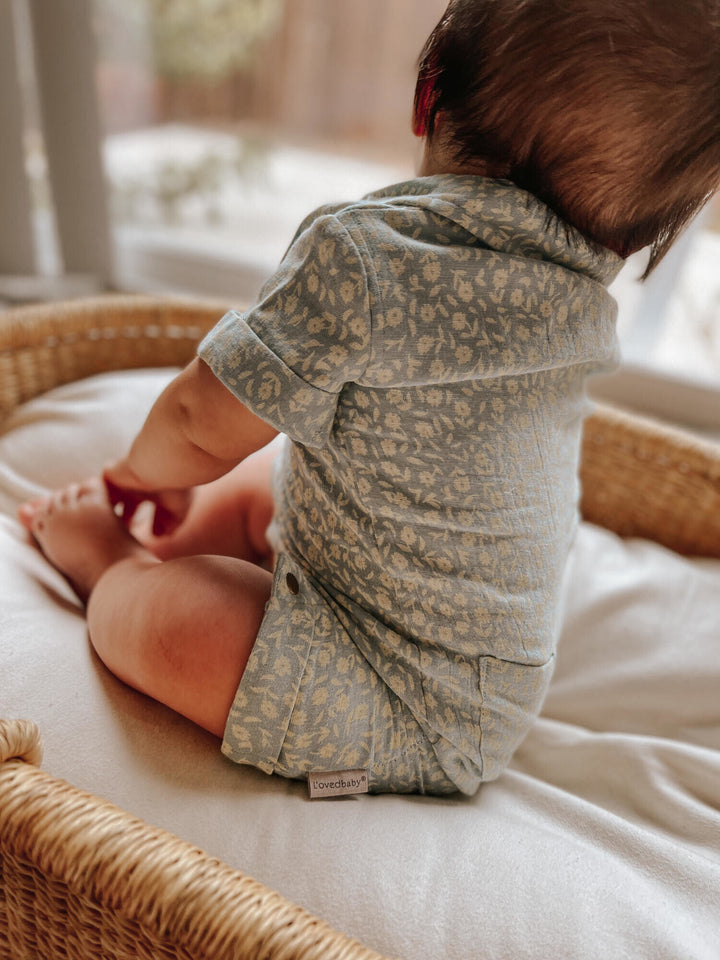Child wearing Printed Muslin S/Sleeve Coverall in Lagoon Floral.