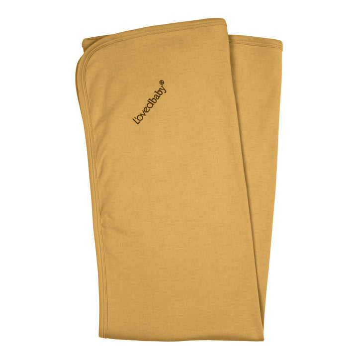 Organic Swaddling Blanket in Honey, a mustard yellow color.