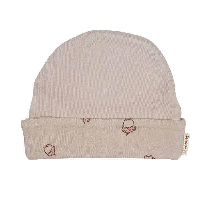 Reversible Beanie in Oatmeal, a light tan color.