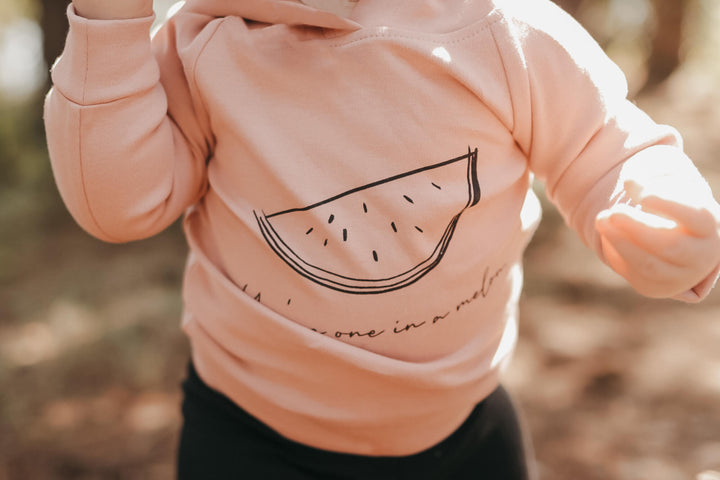 Child wearing Hoodie in Mauve Watermelon.