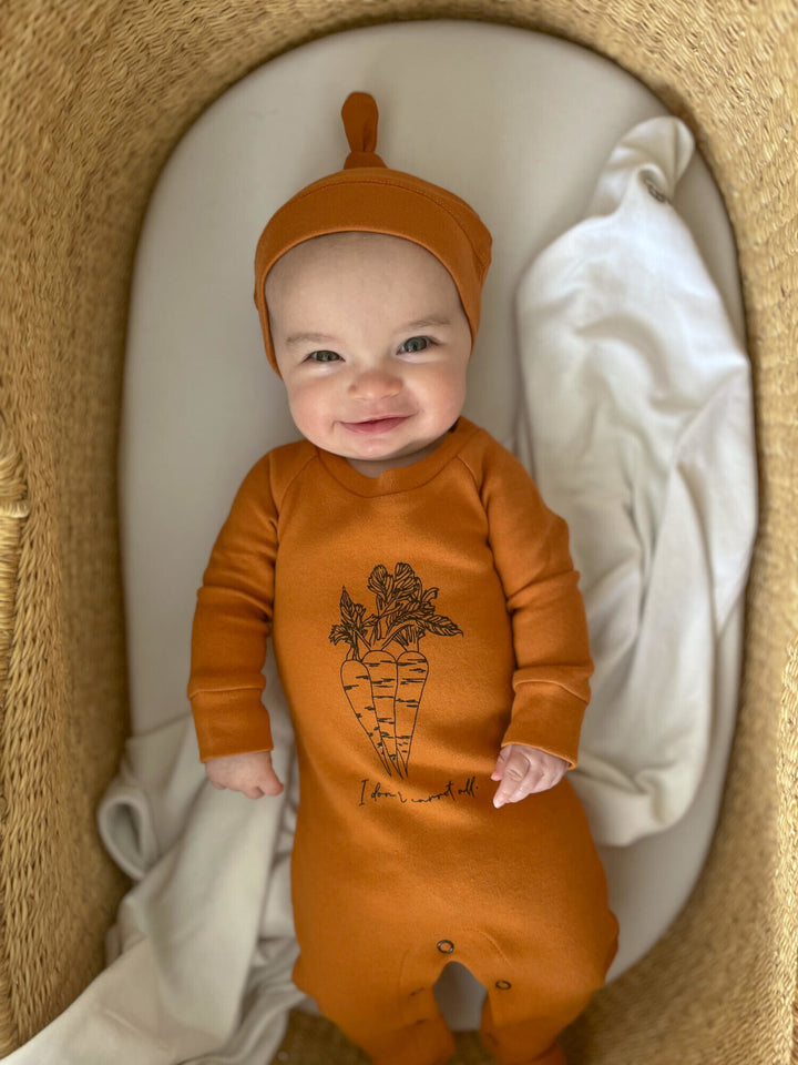Child wearing Organic Banded Top-Knot Hat in Butternut.