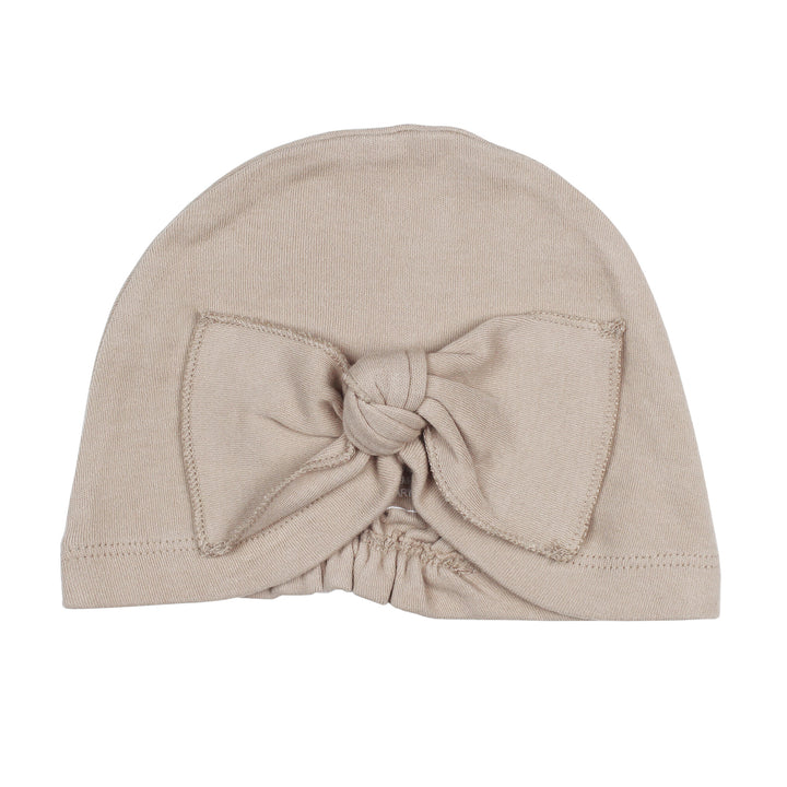 Knotted Turban in Oatmeal, a light tan color.