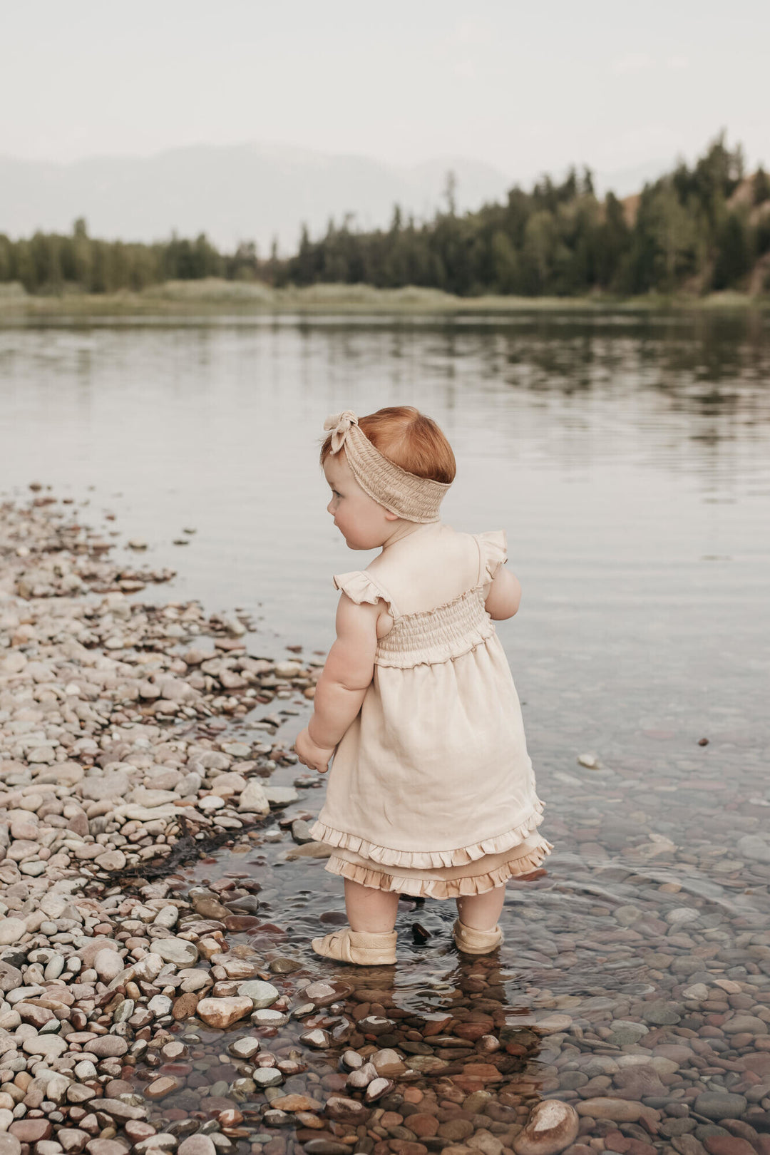 Child wearing Smocked Summer Dress in Oatmeal.