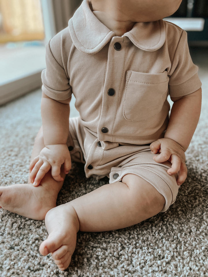Child wearing S/Sleeve Coverall in Oatmeal.