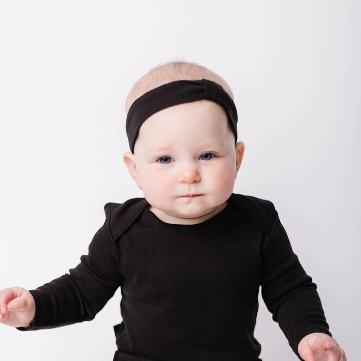 Child wearing Organic Headband in Black.
