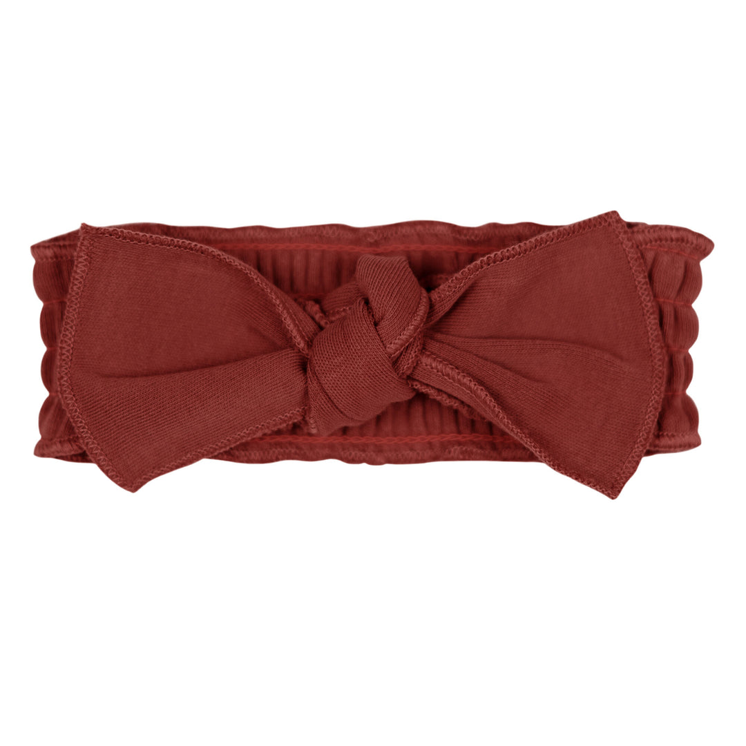Organic Smocked Tie Headband in Spice, a reddish brown color.