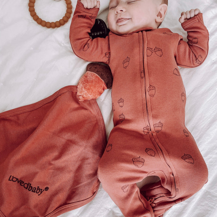 Child wearing Organic Cotton Lovey in Spice.
