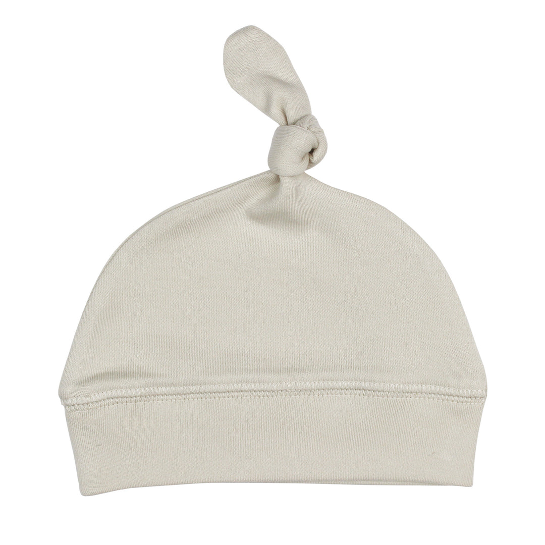 Top-Knot Hat in Stone, an off white color.