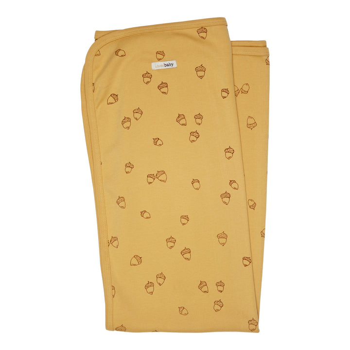 Organic Swaddling Blanket, Print in Honey Acorn, a mustard yellow fabric with brown printed acorns.
