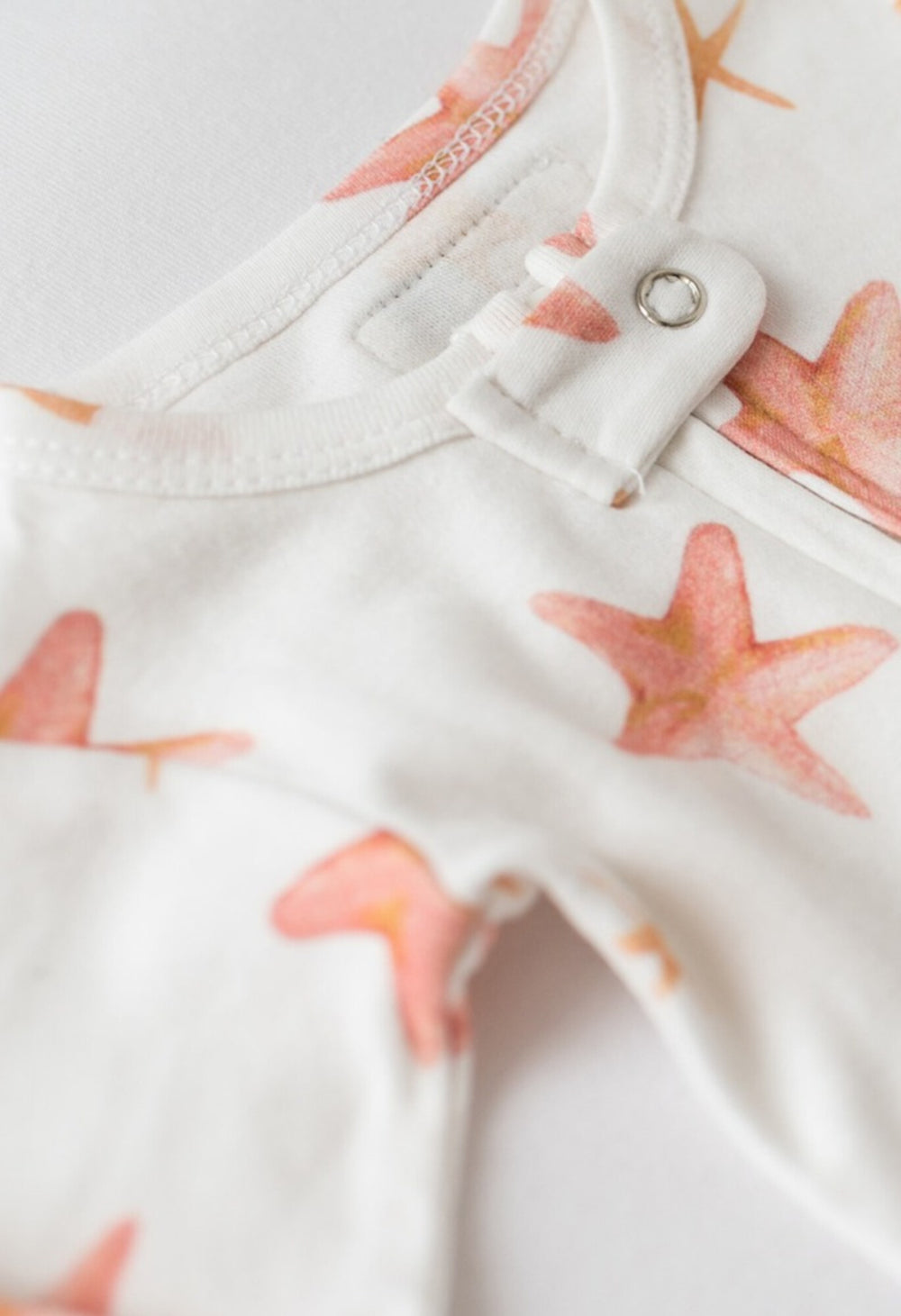 Child wearing Organic Footless 2-Way Zipper Romper in Starfish.