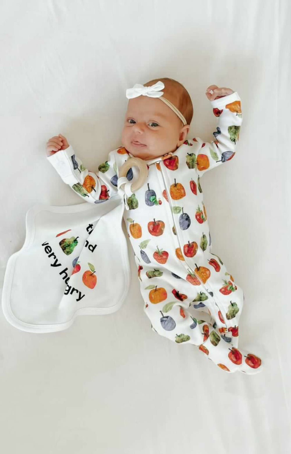 Child wearing Organic 2-Way Zipper Footie in Fruit.