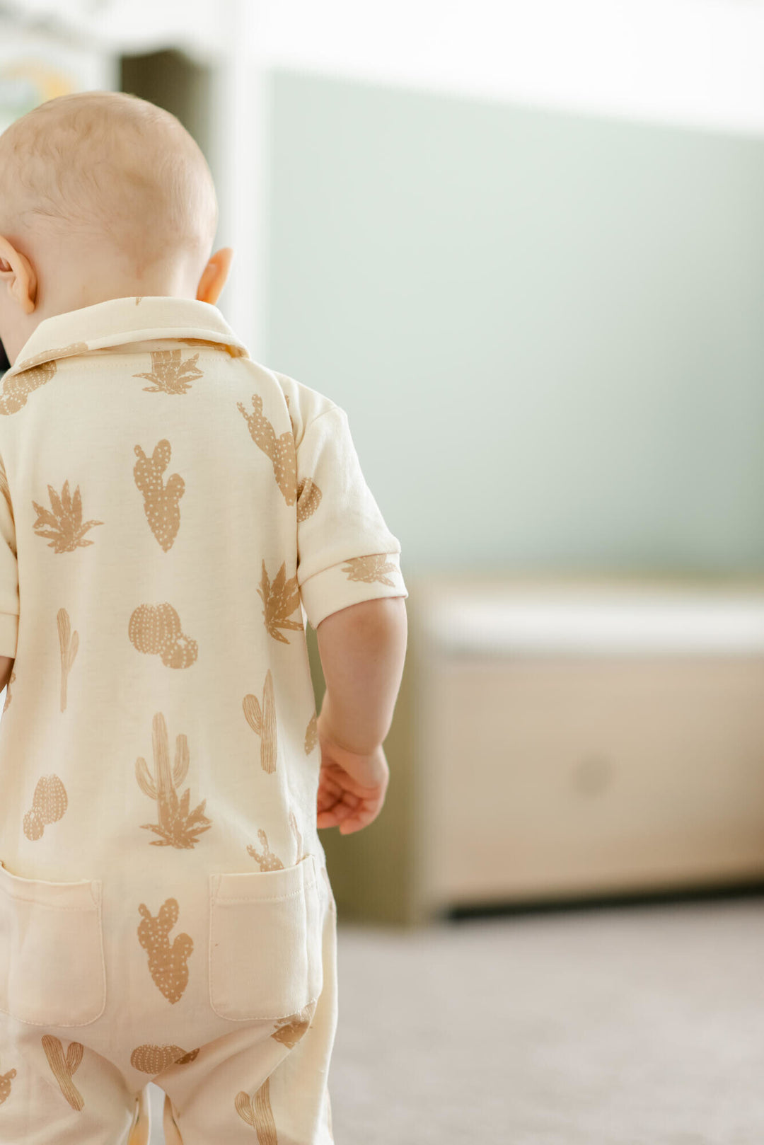 Child wearing Printed S/Sleeve Coverall in Buttercream Cactus.
