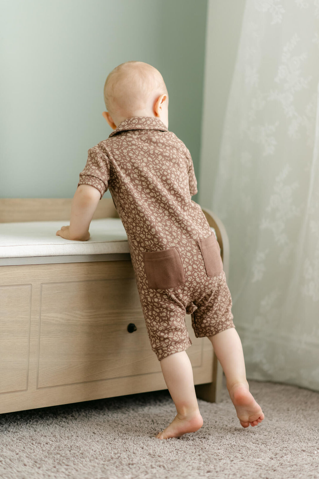Child wearing Printed S/Sleeve Coverall in Latte Floral.