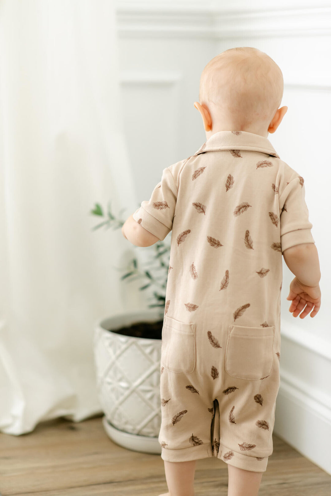 Child wearing Printed S/Sleeve Coverall in Oatmeal Feather.