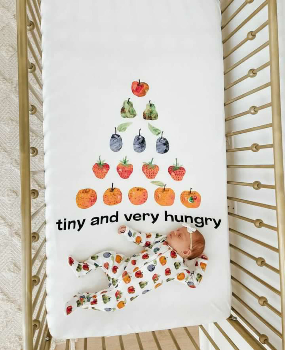 Child wearing Organic Crib Sheet 2-Pack in Very Hungry.