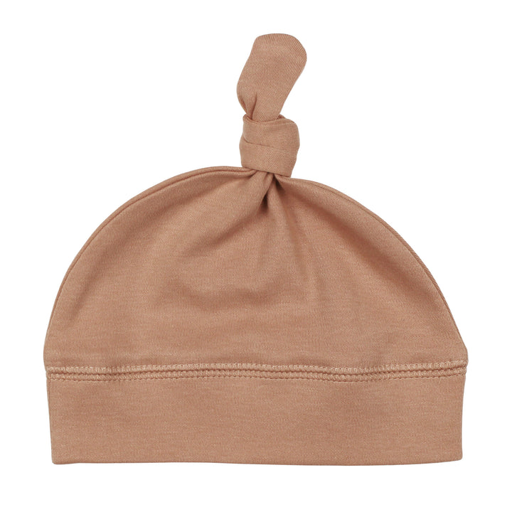 Top-Knot Hat in Adobe, a tan clay color.