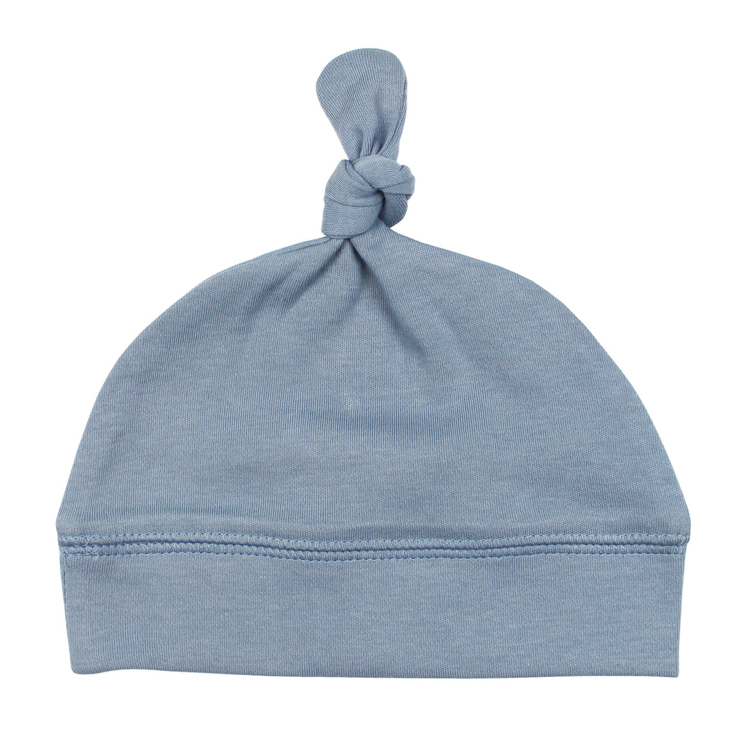 Top-Knot Hat in Pool, an ocean blue color.