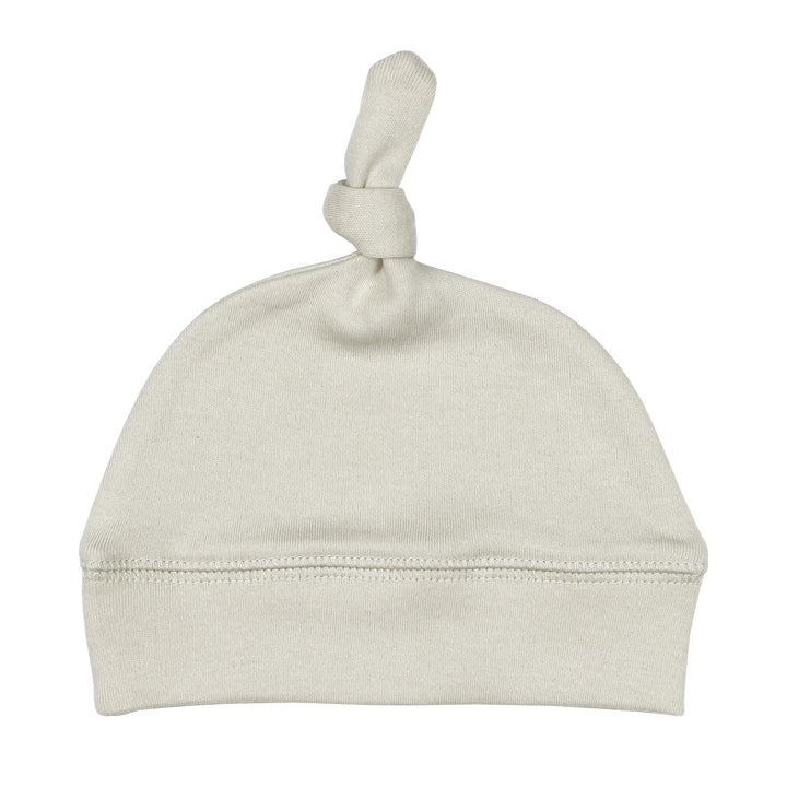 Top-Knot Hat in Stone, an off white color.
