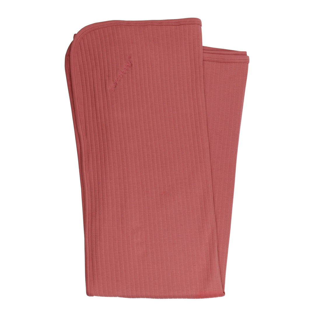 Ribbed Blanket in Sienna, a dark pink color.
