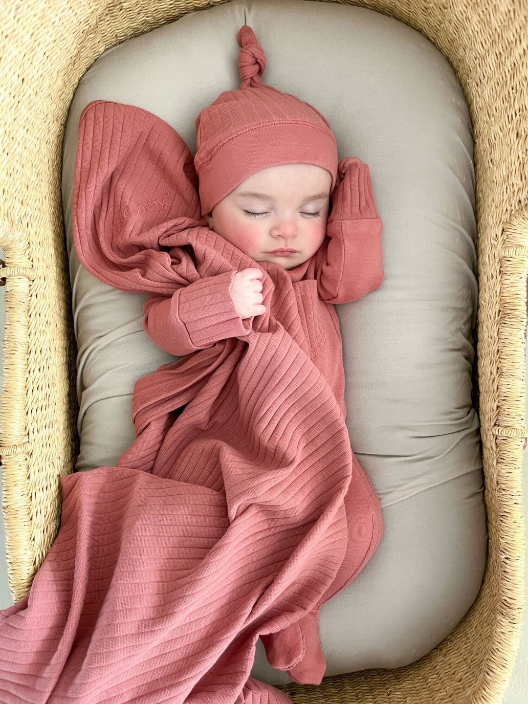 Child wearing Ribbed Blanket in Sienna.