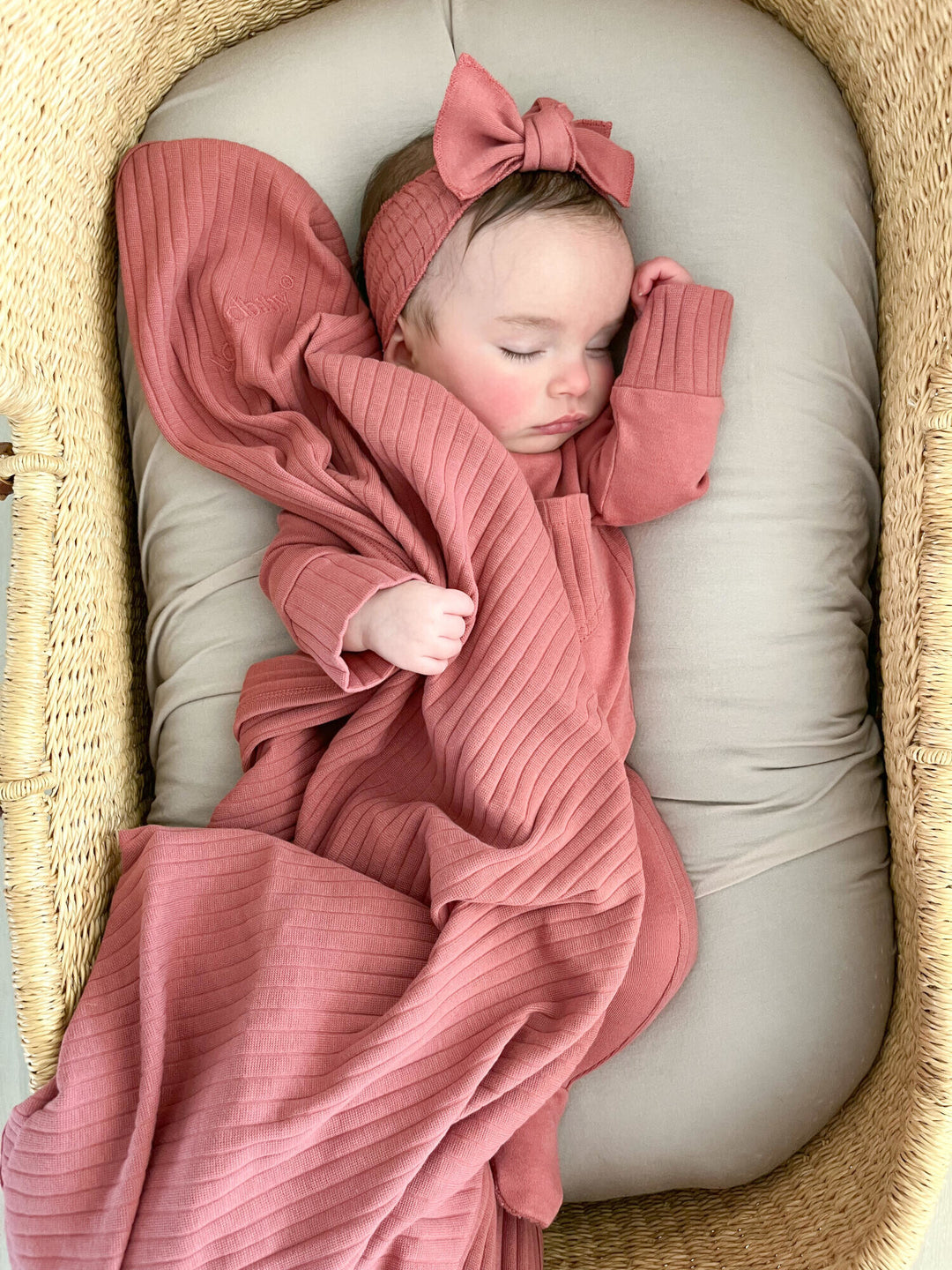 Child wearing Ribbed Blanket in Sienna.