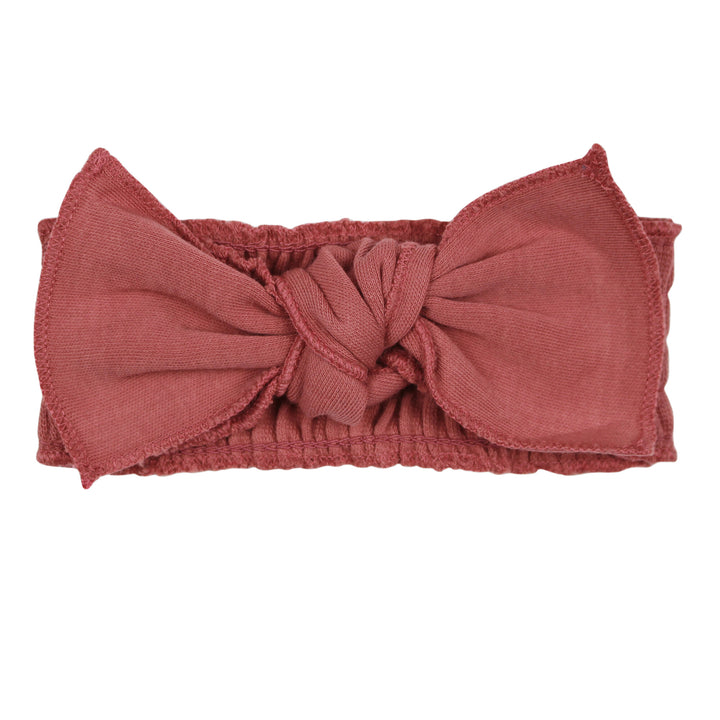 Ribbed Smocked Headband in Sienna, a dark pink color.
