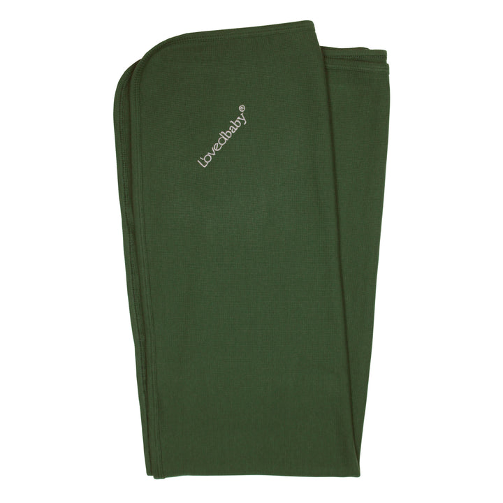 Organic Thermal Swaddling Blanket in Forest, a deep green color.