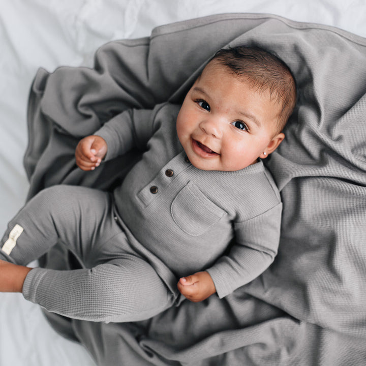 Child wearing Organic Thermal Baby Lounge Set in Mist.