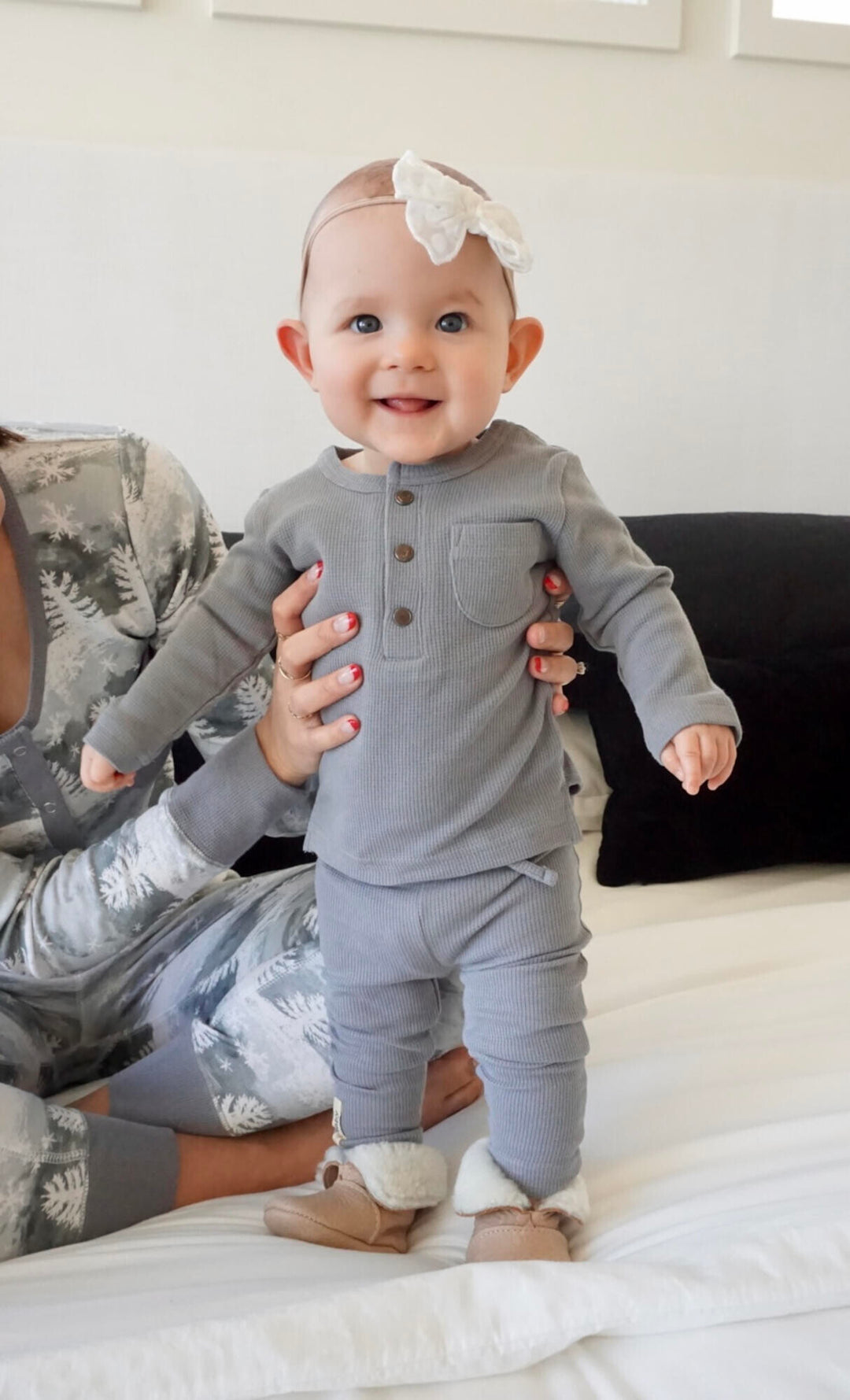 Child wearing Organic Thermal Baby Lounge Set in Mist.