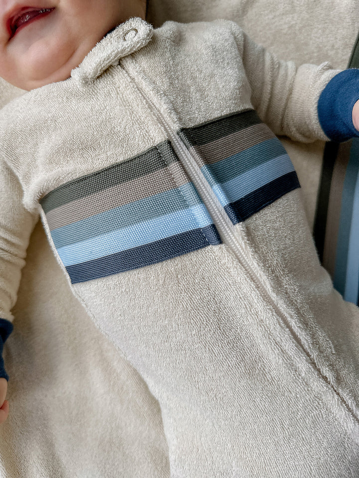 Child wearing Organic Terry Cloth 2-Way Zipper Footie in Blues.