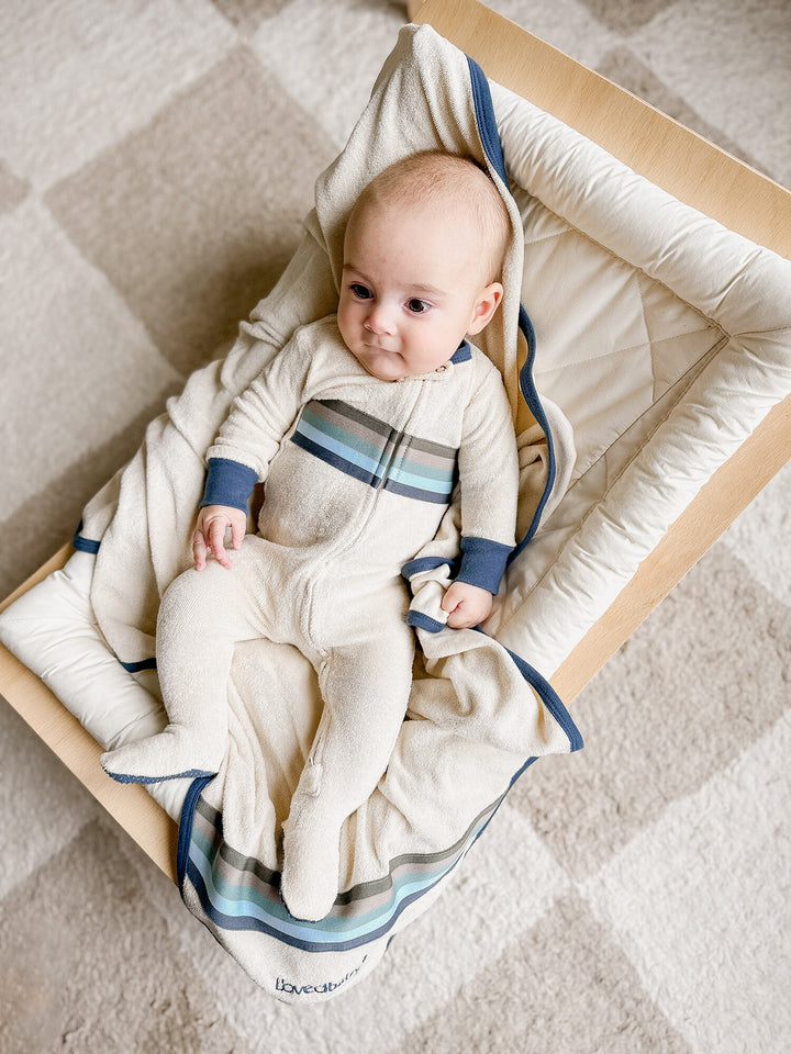 Child wearing Organic Terry Cloth 2-Way Zipper Footie in Blues.