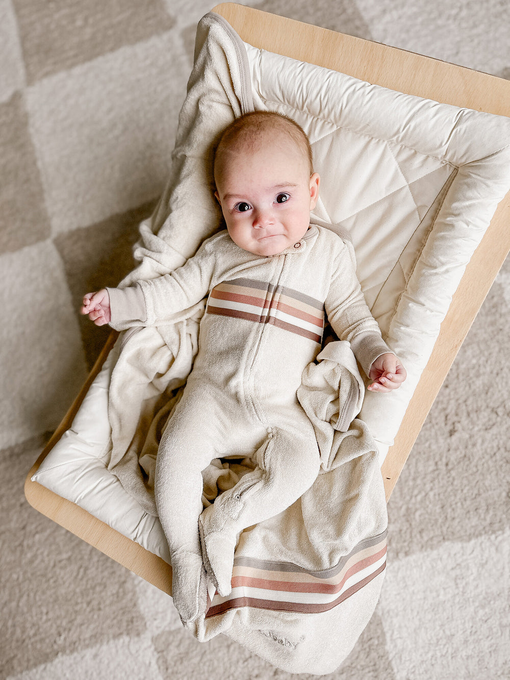 Child wearing Organic Terry Cloth 2-Way Zipper Footie in Neutrals.