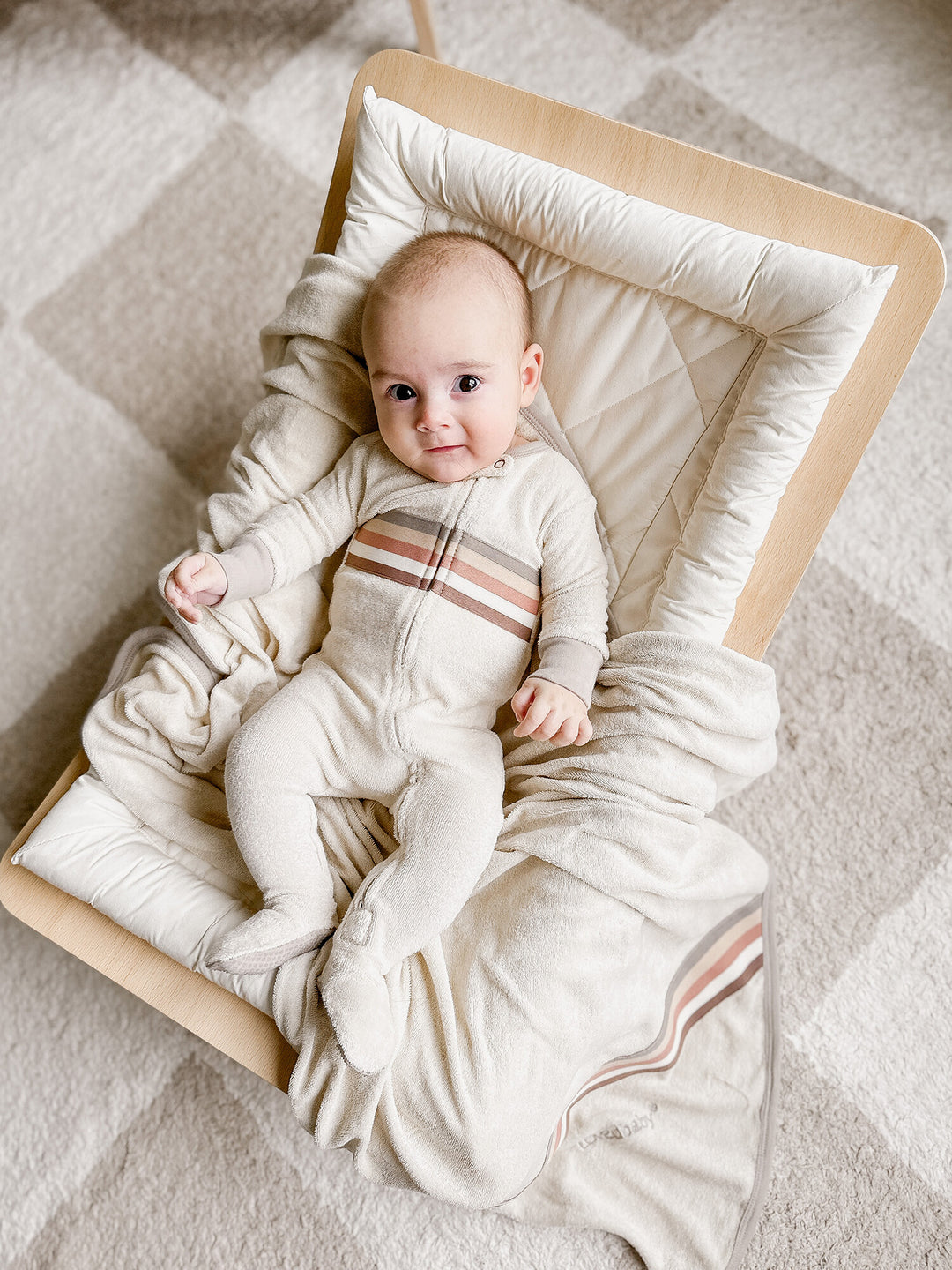 Child wearing Organic Terry Cloth 2-Way Zipper Footie in Neutrals.