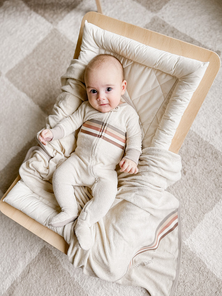 Child wearing Organic Terry Cloth 2-Way Zipper Footie in Neutrals.