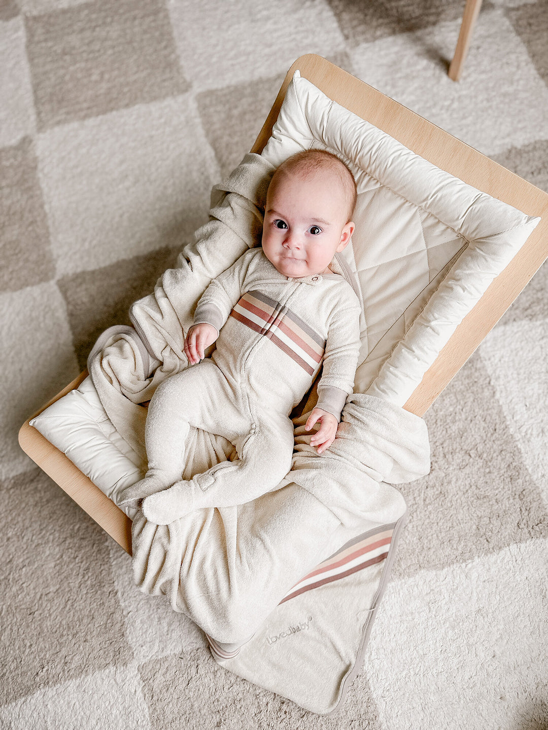 Child wearing Organic Terry Cloth 2-Way Zipper Footie in Neutrals.