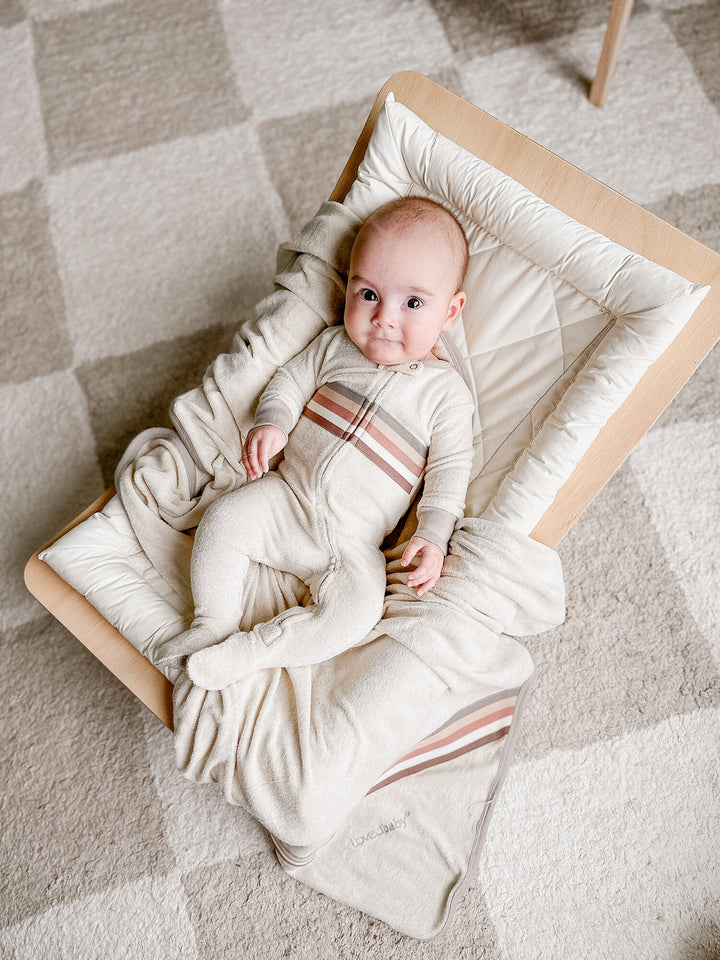 Child wearing Organic Terry Cloth 2-Way Zipper Footie in Neutrals.