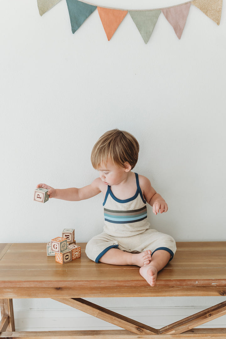 Child wearing Organic Terry Cloth Overall in Blues.