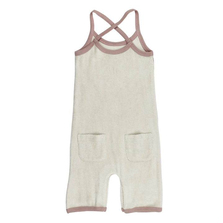 Back view of Organic Terry Cloth Overall in Pinks, a trio of light pink, salmon pink, and medium pink.
