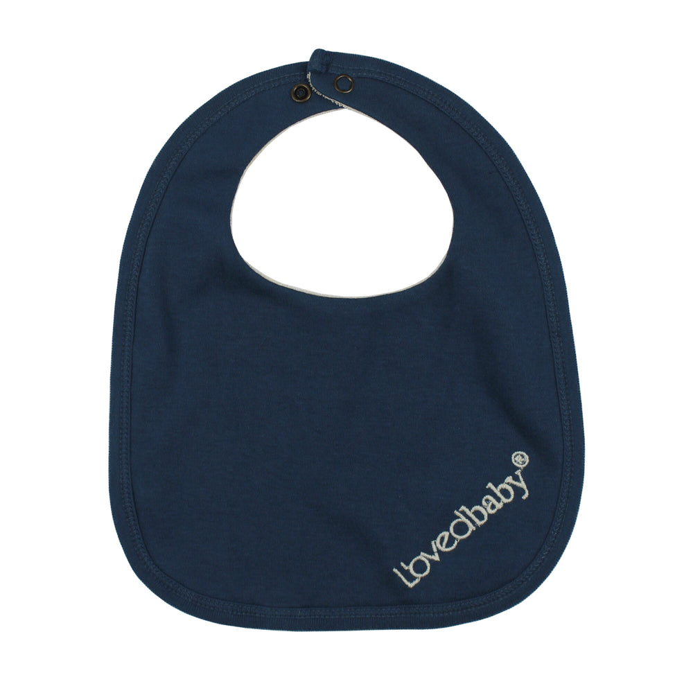 Back view of Organic Terry Cloth Reversible Bib in Blues, a trio of light gray, medium blue and dark blue.