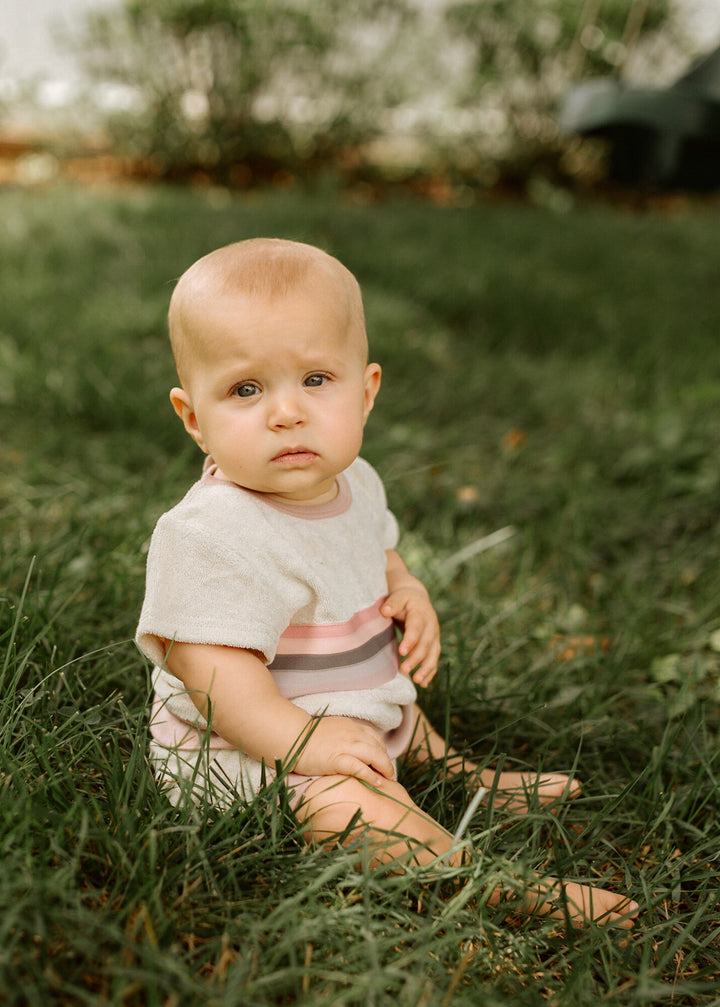 Child wearing Organic Terry Cloth Tee & Shortie Set in Pinks.