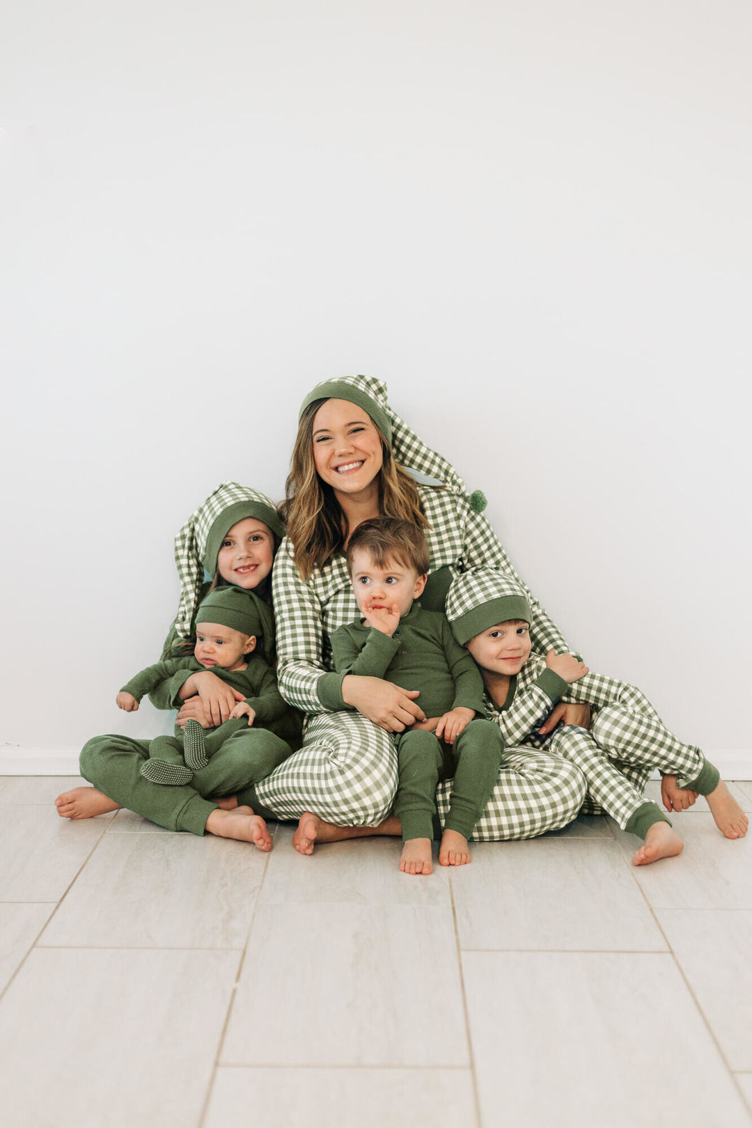 Child wearing Organic Holiday Women's 2-Pc Lounge Set with Cap in Christmas Eve Plaid.
