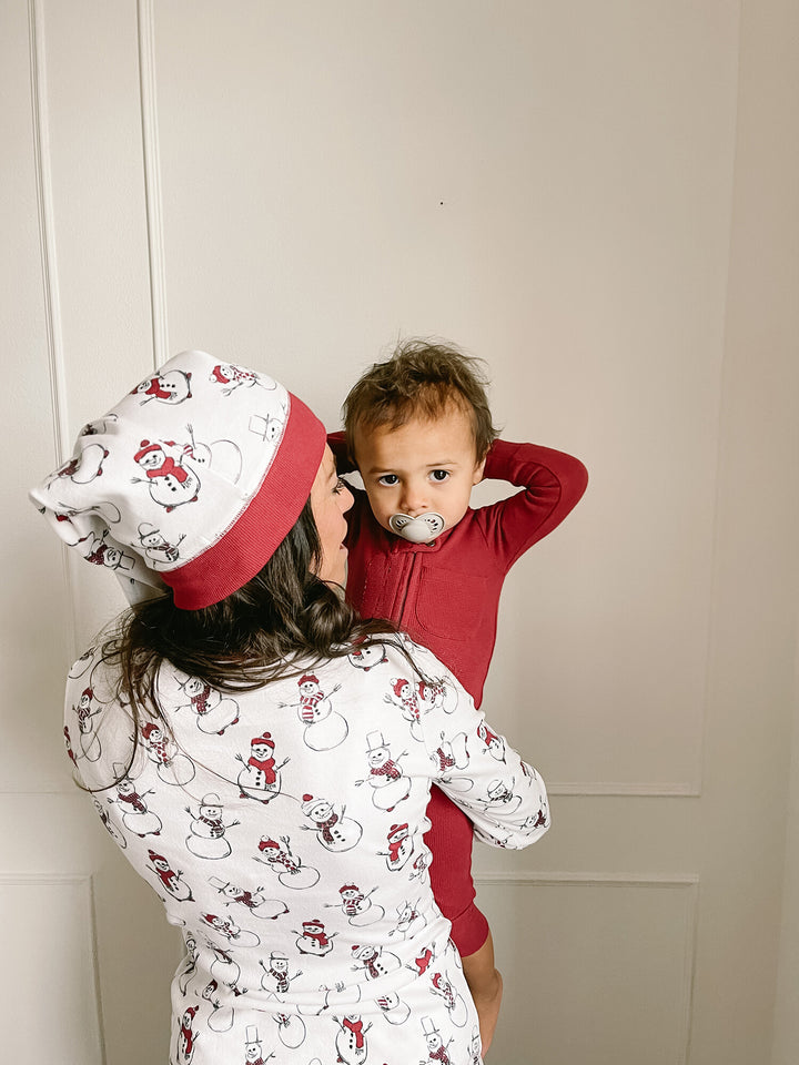 Child wearing Women's Organic Holiday 2-Pc Lounge Set with Cap in Snow Day.