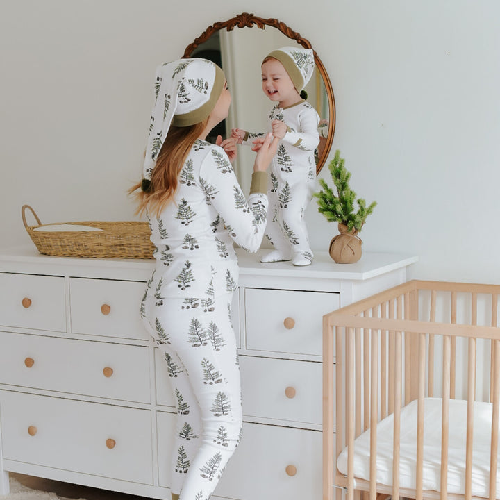 Child wearing Women's Organic Holiday 2-Pc Lounge Set with Cap in Under The Tree.