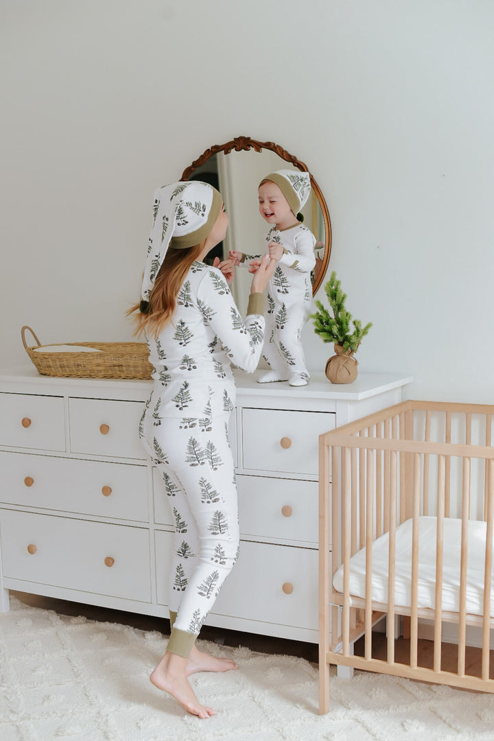 Child wearing Women's Organic Holiday 2-Pc Lounge Set with Cap in Under The Tree.