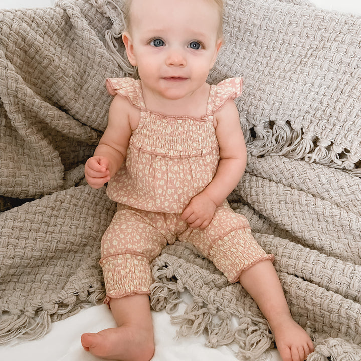Child wearing Printed Muslin Sleeveless Romper in Carnation Floral.