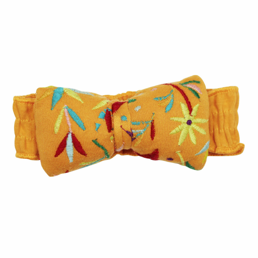 Embroidered Bowtie Headband in Tangerine Floral, an orange base fabric with multi colored embroiderred flowers.
